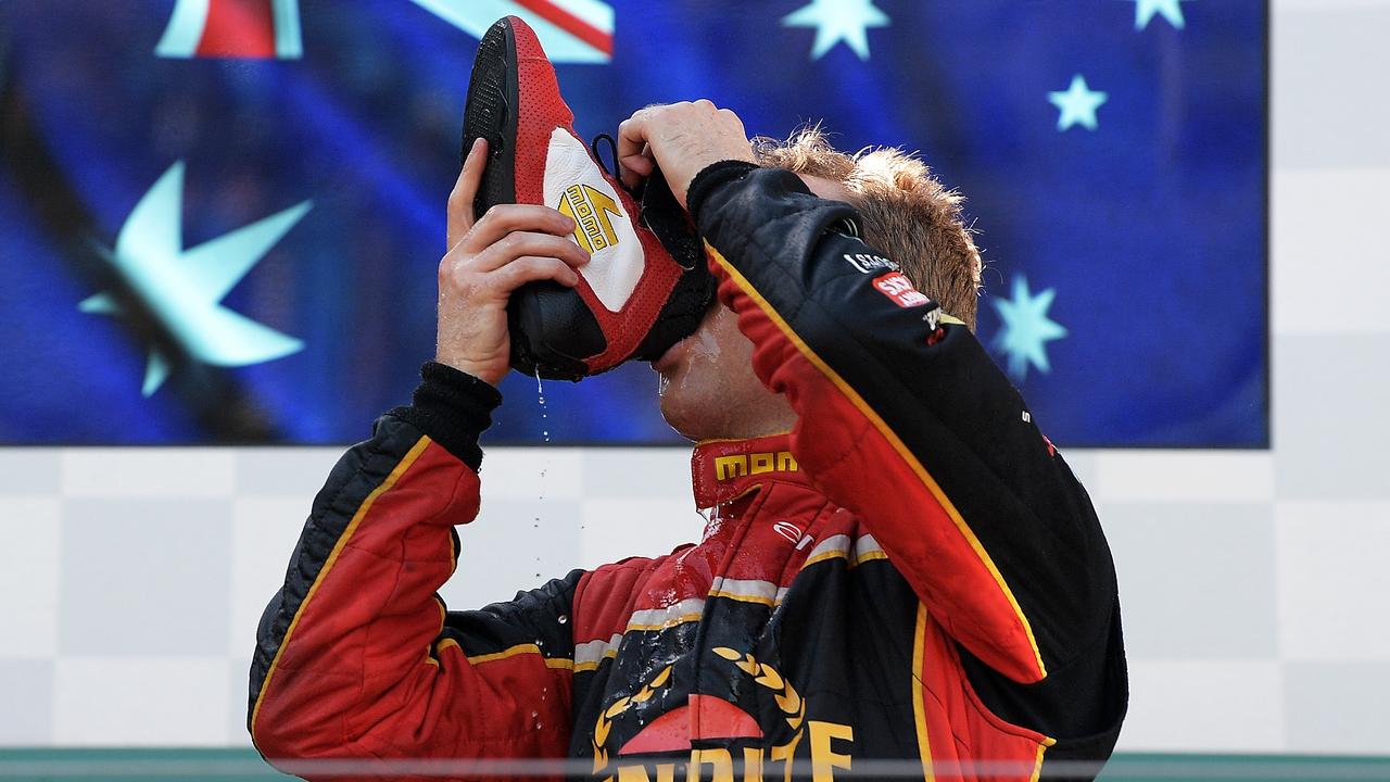 Supercars driver David Reynolds celebrates winning race four of the Melbourne Supercars round with a ‘Shoey.’
