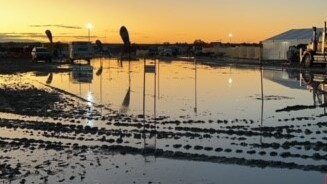 About 6000 patrons have their boots in the mud camping out at the remote Big Red Bash festival at Birdsville, QLD. Picture: Queensland Ambulance Sercive / Facebook