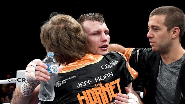 Jeff Horn celebrates victory with trainer Glenn Rushton and brother Ben after the middleweight bout between Jeff Horn and Michael Zerafa.