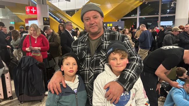 Dan and his sons Leo and Ari were planning to heading home to Cairns on Friday evening. Picture: Oscar Jaeger