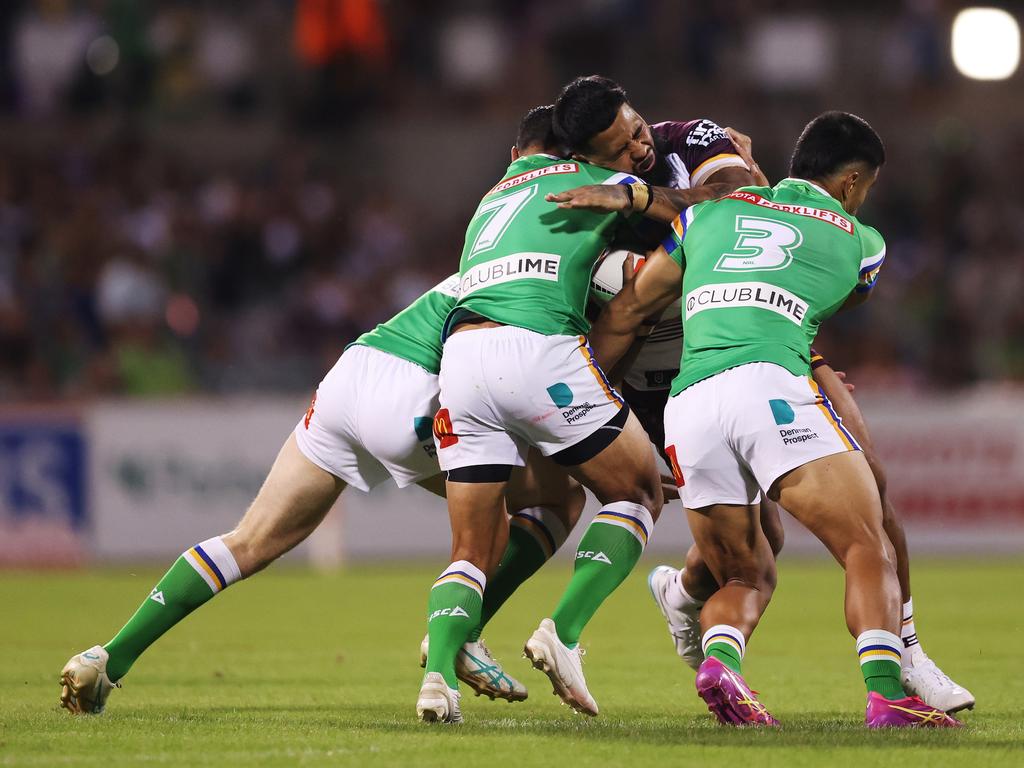 Payne Haas is man handled by three Raiders players. Picture: Mark Metcalfe/Getty Images