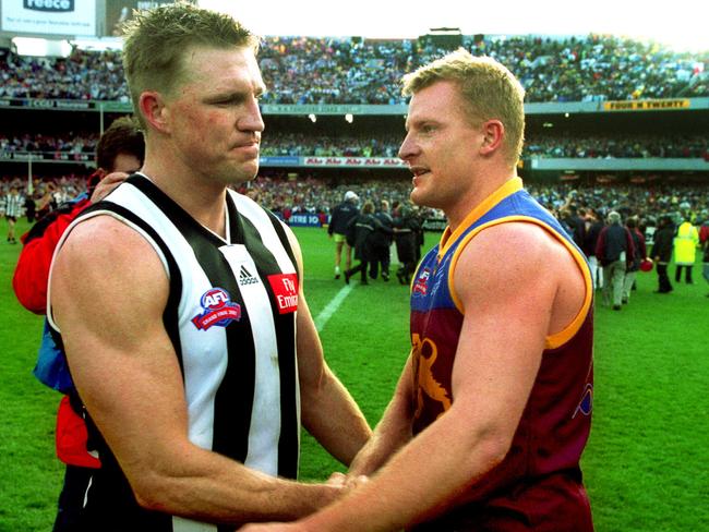 Michael Voss shakes Nathan Buckley’s hand after the 2002 Grand Final.