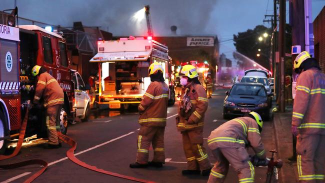 A factory fire in Brunswick has blanketed the area in smoke. Picture: David Crosling