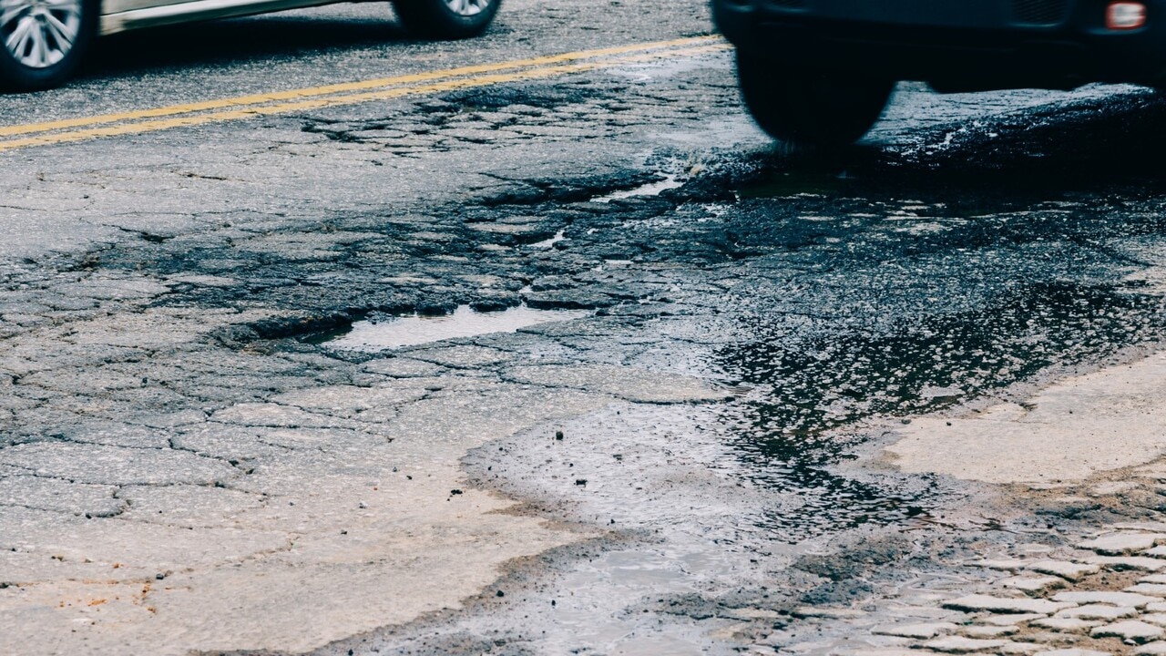 Victorian government slammed for cutting back on road repairs