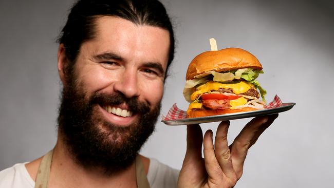 George McLean of JB &amp; Sons with his double beef and bacon burger. Picture: Troy Snook