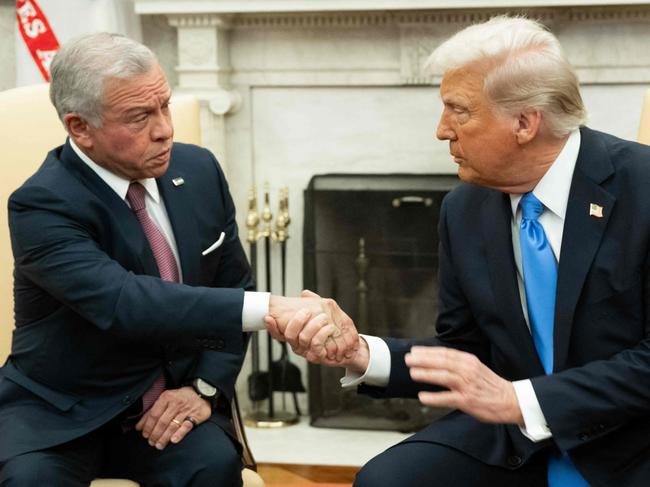 US President Donald Trump (R) shakes hands with King Abdullah II of Jordan during a meeting in the Oval Office of the White House in Washington, DC, on February 11, 2025. (Photo by SAUL LOEB / AFP)