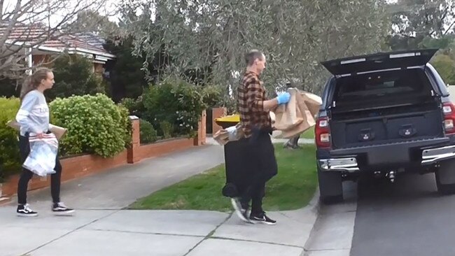 Police seize evidence from the home of a Glenroy man after the alleged shooting. Picture: Victoria Police