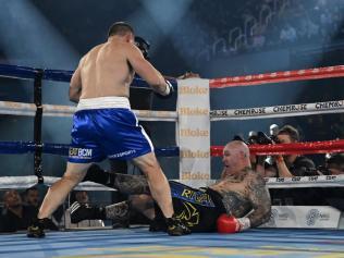 Lucas Browne slumps into the ropes.