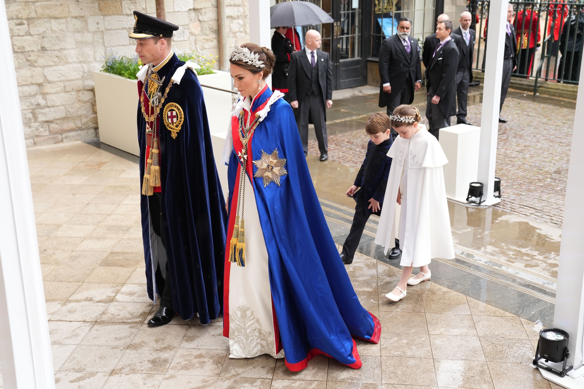 <h2>Kate’s dress</h2><p>The event of King Charles’s coronation today, then, demanded a similar aptitude from Kate, who rose to the occasion with deftness. The Princess of Wales wore an ivory Alexander McQueen silk crepe gown, embroidered with the national flora of the United Kingdom: roses for England, thistles for Scotland, daffodils for Wales and shamrocks for Ireland. A floor-length dress, arguably, was always going to be the most likely option for Kate, who has adhered firmly to demure hemlines since embracing her role as the Princess of Wales and next-in-line as queen consort. She accessorised with pointed white court shoes underneath her sweeping dress, and coordinated with her daughter, Princess Charlotte, who wore a matching Alexander McQueen piece.</p>