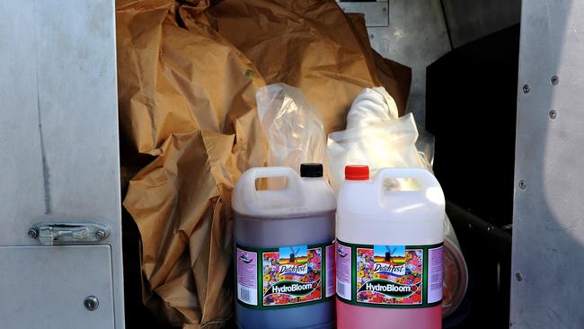 Plants and chemicals found in a Burleigh Waters raid. Pic John Gass