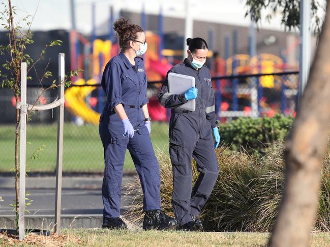 Forensic crews gather evidence at the scene. Picture: David Crosling