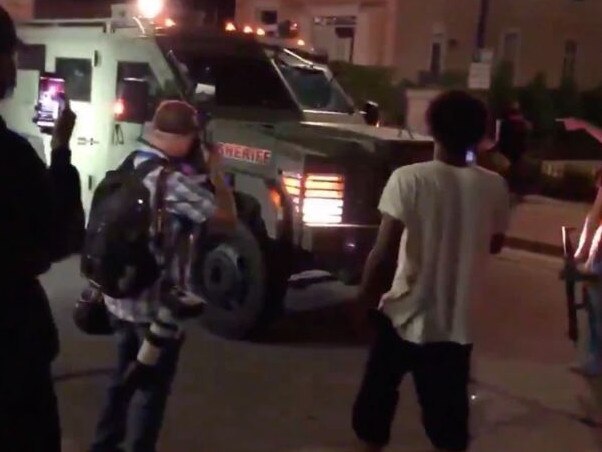 Protesters confront a SWAT vehicle after police shot Jacob Blake seven times in the back. Picture: Twitter