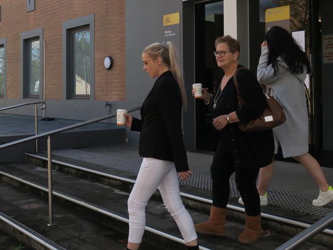 Tahlia O'Grady (white pants), 21, of Wyee, leaves Wyong Local Court after being sentenced to a 20-month Intensive Corrections Order. Picture: Richard Noone