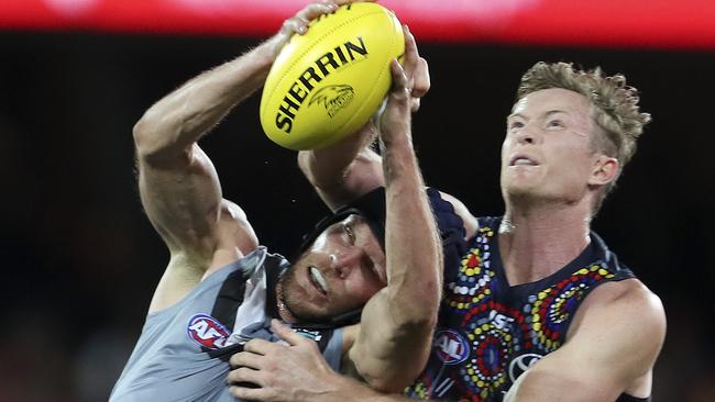 AFL - SHOWDOWN 47 - Adelaide Crows v Port Adelaide at the Adelaide Oval. Brad Ebert loses his helmet in a contest with Alex KEath. Picture SARAH REED