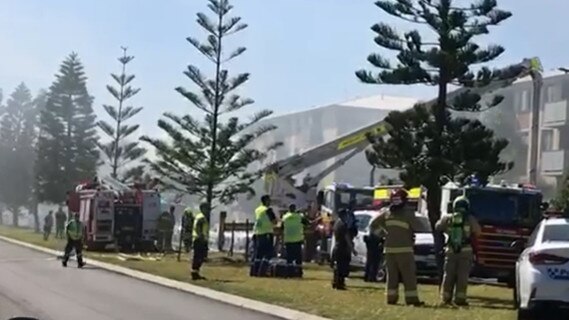 Residents have been evacuated from an apartment block in Merewether after a third floor unit caught fire. Credit: ABC