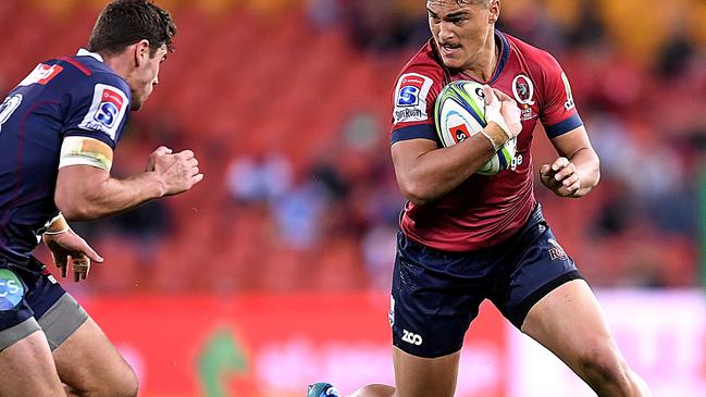 Jordan Petaia of the Reds takes on the defence during the Round 18 Super Rugby match between the Queensland Reds and the Melbourne Rebels at Suncorp Stadium in Brisbane, Friday, July 6, 2018. (AAP Image/Albert Perez) NO ARCHIVING, EDITORIAL USE ONLY