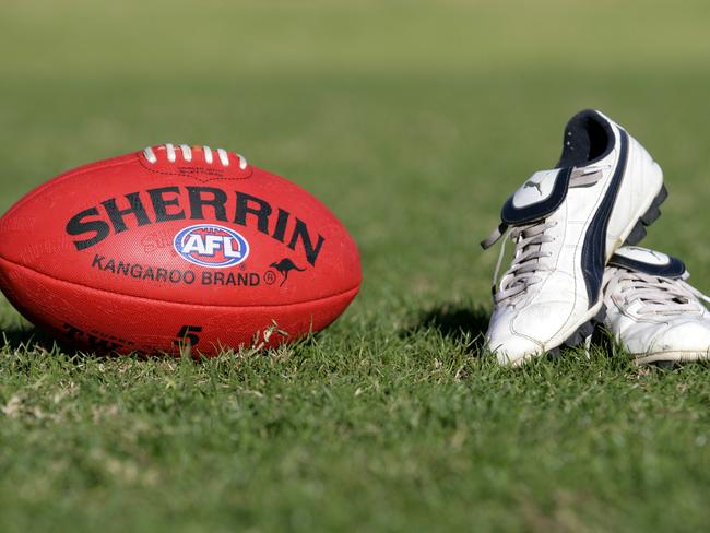 Generic AFL Sherrin football and football boots. sport /