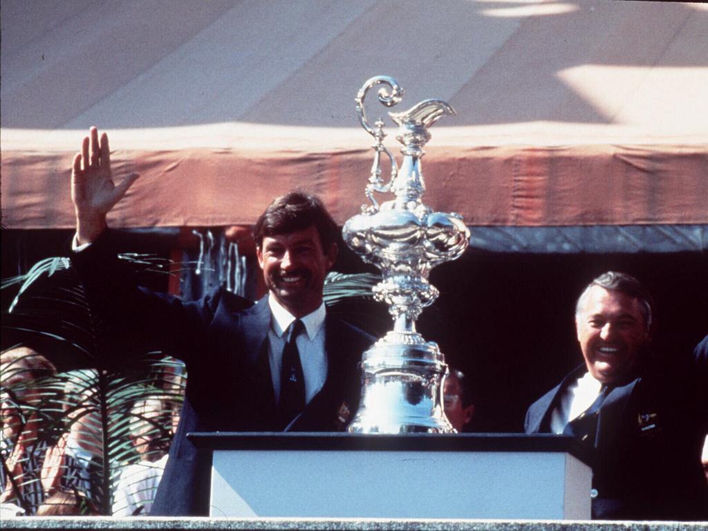 Skipper John Bertrand with WA businessman Alan Bond and 1983 America’s Cup trophy.