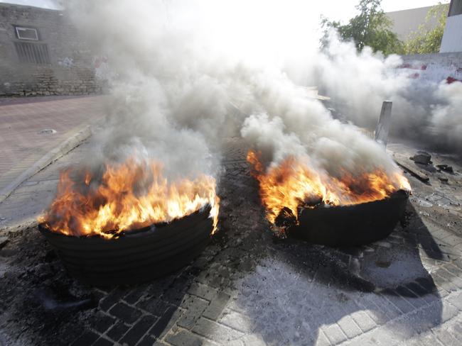 Tire fires burn in a third straight day of protests against Saudi Arabia's execution of Saudi Shiite cleric Sheikh Nimr al-Nimr in the western Shiite village of Karzakan, Bahrain. Picture: AP