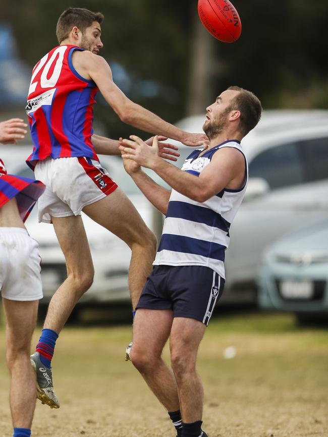 Rye’s Tyrren Head (left) and Chelsea coach James Brain collide last week. Picture: Valeriu Campan