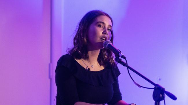 Jem Cassar-Daley sings for the audience at Coutts hall.