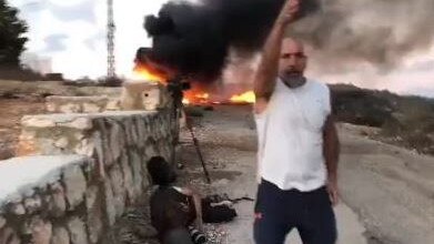 A camera capturing a livestream shot of Israel‘s border from Lebanon records a heavy sounding boom before dust erupts into the air and screams and shouts can be heard.