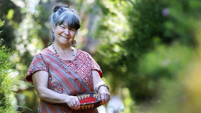 Kris Schaffer collects plants in her bush garden at her home in Neika in the foothills of Mt Wellington. Picture: SAM ROSEWARNE