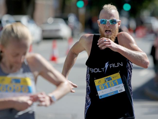 Men's 6km event winner David Thomas crosses the finish line in the Race to the Taste. Picture: PATRICK GEE