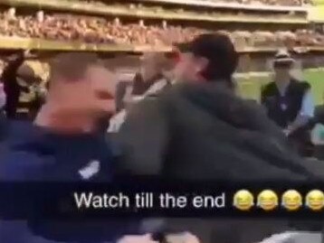 A man celebrating Glenelg's SANFL win is bumped by a sore loser at Adelaide Oval. Source: ShitAdelaide/Instagram