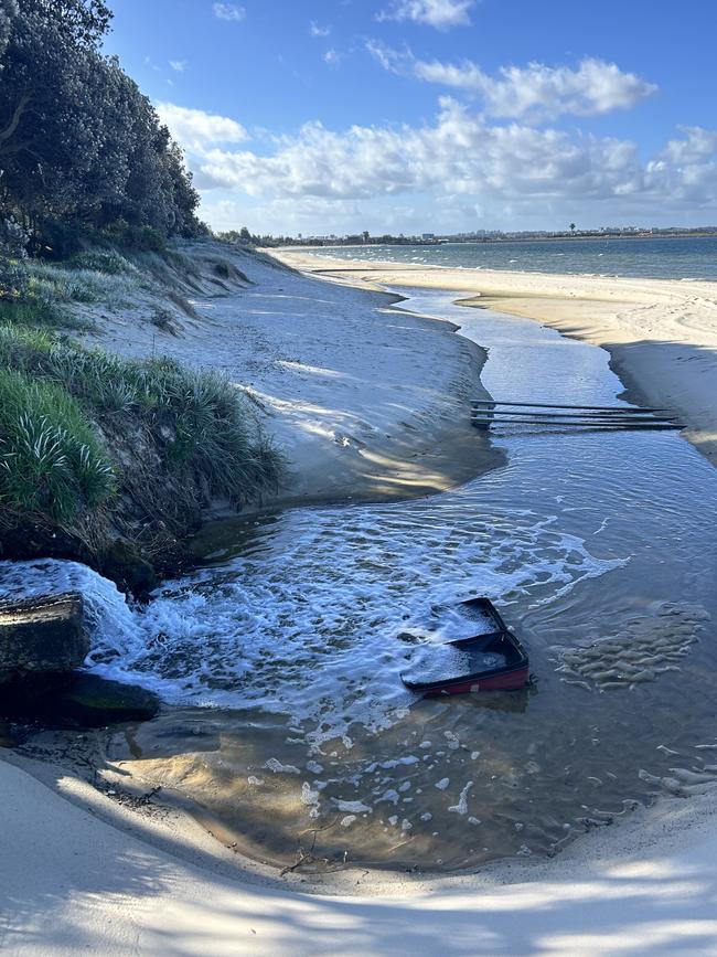 The water is dumped into the ocean on the Lady Robinson Beach in Brighton-Le-Sands. Picture: Tileah Dobson