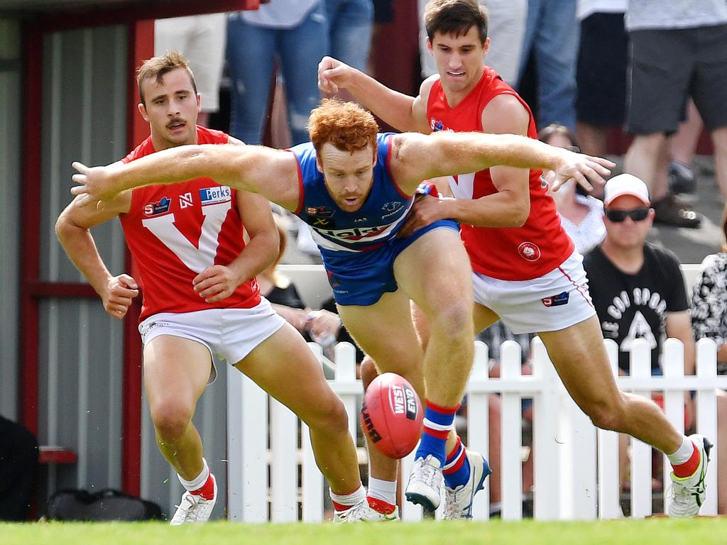 19/04/19 - SANFL: North Adelaide v Central District at Prospect Oval. Central's Murray Stephenson hovers over the ball. Picture: Tom Huntley