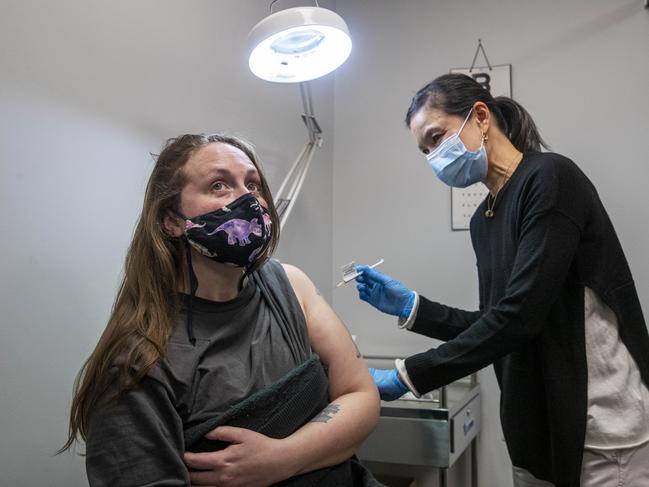 Adrienne Chan gives Grace Anthony, 35, a dose of AstraZeneca. Picture: Aaron Francis