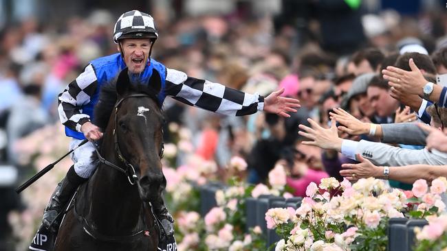 Mark Zahra celebrates with the crowd after his 2022 Melbourne Cup victory aboard Gold Trip. Picture: Quinn Rooney / Getty Images