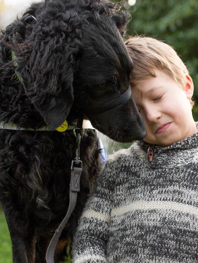 Henry Lee gives Black Betty a cuddle.