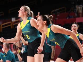 SAITAMA, JAPAN - AUGUST 02: Bec Allen #9 and teammate Sara Blicavs #8 of Team Australia cheer on their team from the bench during the first half of their Women's Basketball Preliminary Round Group C game against Puerto Rico on day ten of the Tokyo 2020 Olympic Games at Saitama Super Arena on August 02, 2021 in Saitama, Japan. (Photo by Gregory Shamus/Getty Images)