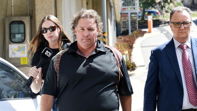 Justen Shawn Orford, 47, walks from the Townsville Watchhouse with defence lawyer Anderson Telford on July 30. Picture: Shae Beplate.