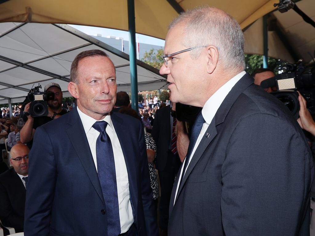 Scott Morrison and Tony Abbott cross paths at a Good Friday church service. Picture Gary Ramage
