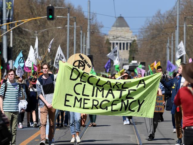 Climate change protesters are seen outside Flinders Street Station. Picture: AAP