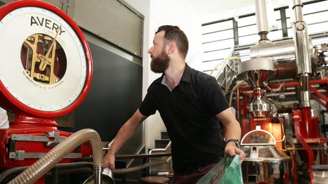 Jabin Roper prepares beans for roasting at Paradox. Photo: Tertius Pickard.