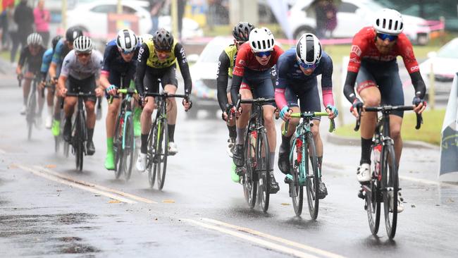 Cyclists ride through the main street of Yungaburra in the pouring rain during the 2019 Tour of the Tropics. PICTURE: ANNA ROGERS