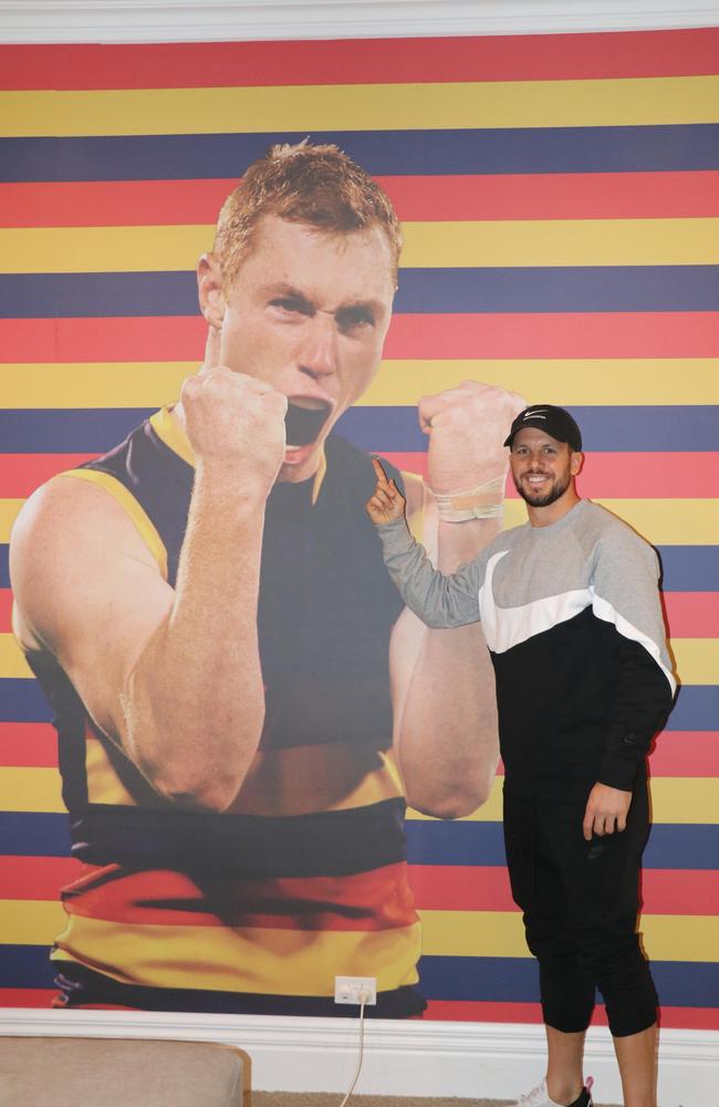 Travis Boak seems to take the mural in his stride. Picture: Daniel Bryant/MIX 102.3