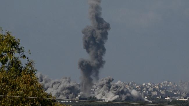 Smoke rises from buildings in northern Gaza as the Israeli military conducts a bombardment on Sunday. Picture: Getty Images