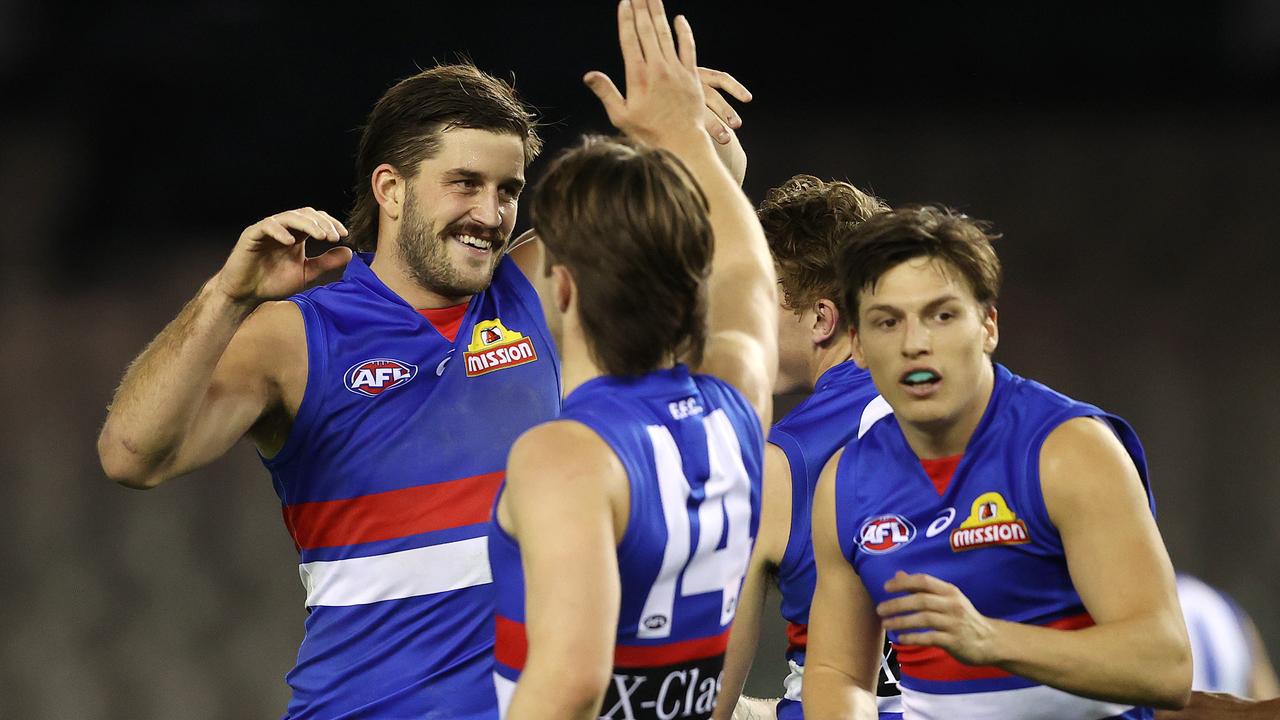 AFL Round 5. . 04/07/2020. Western Bulldogs v North Melbourne at Marvel Stadium. Josh Bruce of the Bulldogs celebrates his 4th goal with teammates . Pic: Michael Klein