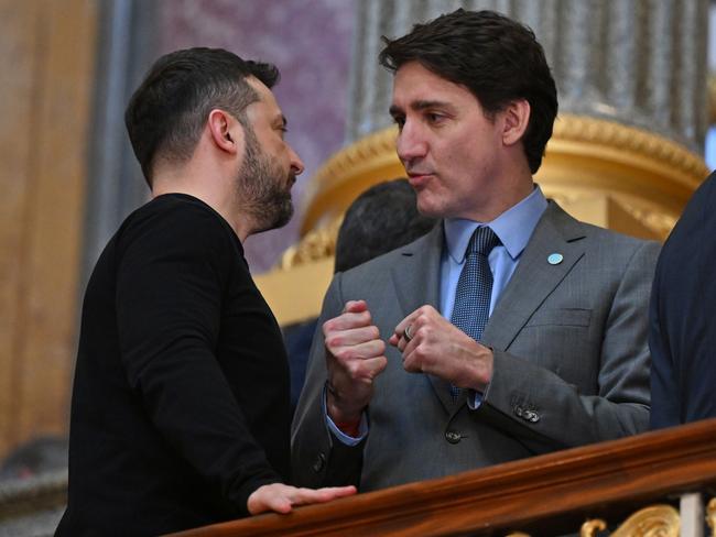 LONDON, ENGLAND - MARCH 2: Ukrainian President Volodymyr Zelensky (L) and Canadian Prime Minister Justin Trudeau (R) speak on the stairs on their way to a plenary meeting at a summit held at Lancaster House on March 2, 2025 in London, England. Following this week's meetings between Keir Starmer, Emmanuel Macron, and US President Donald Trump, a meeting convenes in London with European leaders to discuss future peace in Ukraine. (Photo by Justin Tallis - WPA Pool/Getty Images)