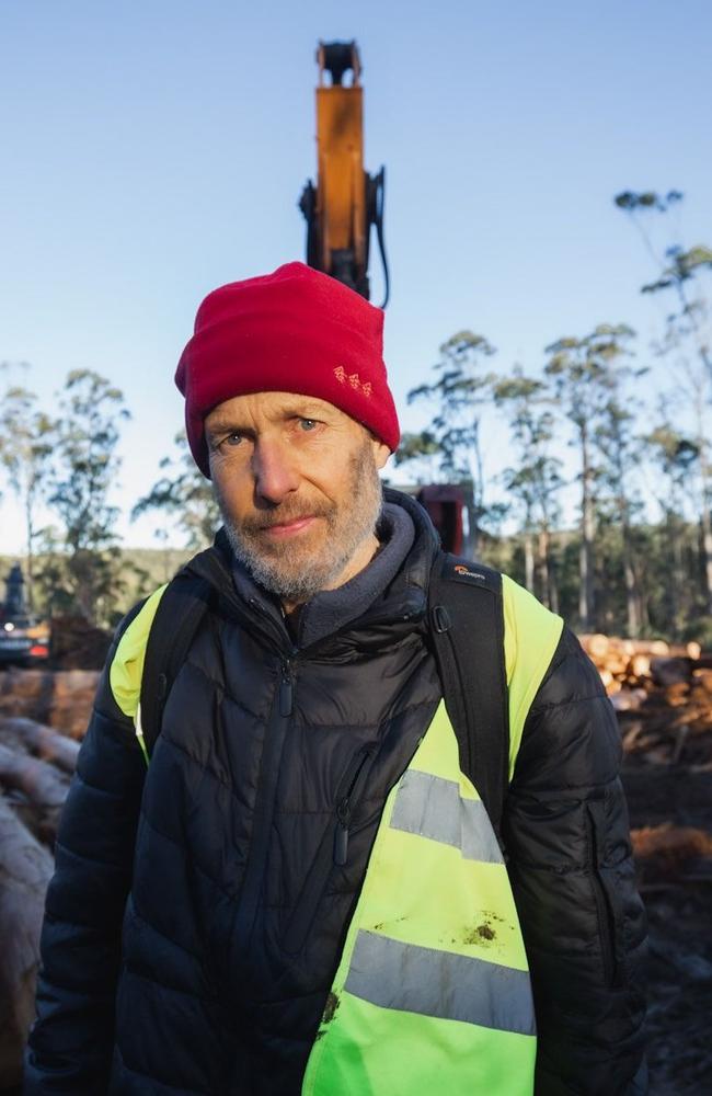 Tasmanian photographer Rob Blakers was arrested and charged with trespass after refusing to leave a logging site in the Eastern Tiers, near where he previously documented swift parrot nesting sites.