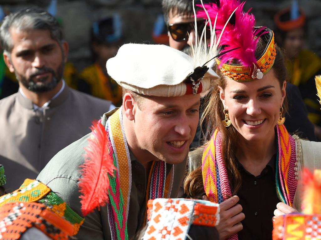 Prince William speaks with local people about climate change in their village. Picture: FAROOQ NAEEM / AFP)