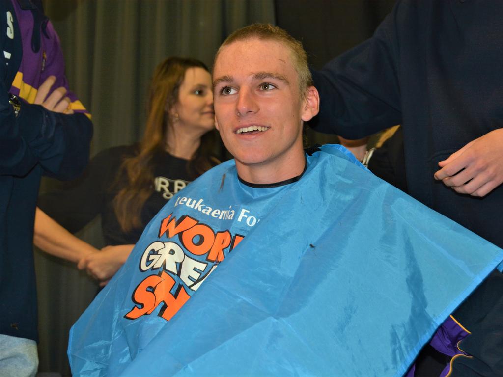 At the St Joseph's College 2023 World's Greatest Shave event is student Charlie Kruger having his hair cut by friends. Picture: Rhylea Millar