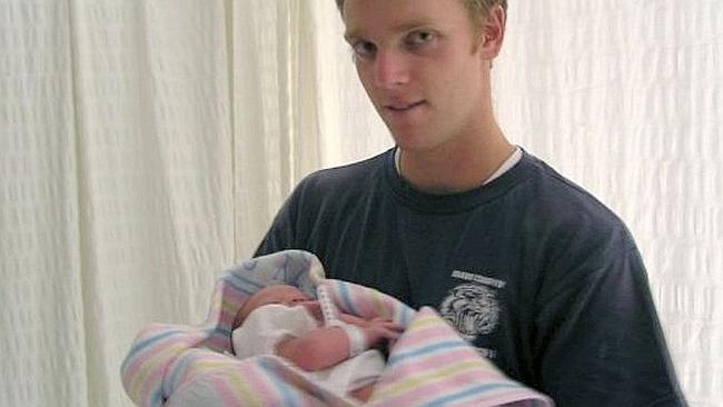  Corporal Mathew Hopkins with his new born son Alex. 