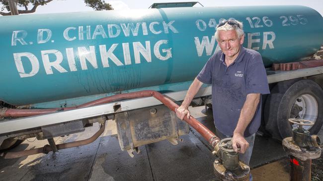 Rodney Chadwick of R.D. Chadwick Drinking Water of Woodbridge fills up at Kingston. PICTURE CHRIS KIDD