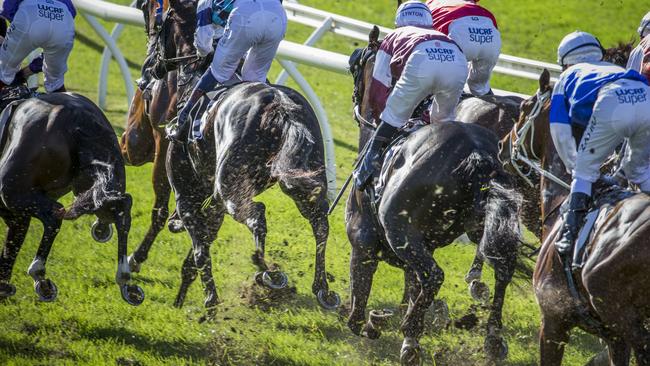 Excessive turf kickback occurring on the track during the Darley Kingsford Smith Cup Day, formerly BTC Cup Day, at Eagle Farm Racecourse in Brisbane, Saturday, May 27, 2017. (AAP Image/Glenn Hunt) NO ARCHIVING, EDITORIAL USE ONLY